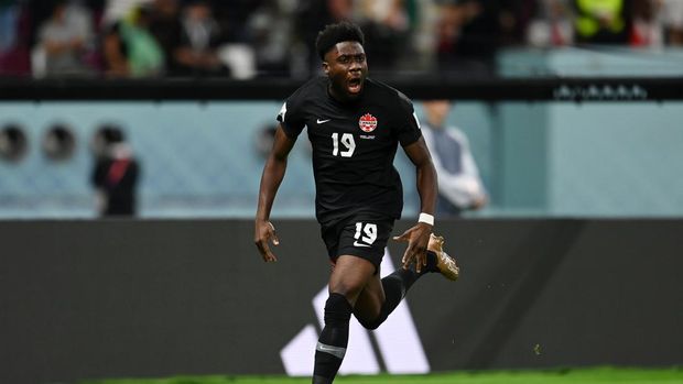 DOHA, QATAR - NOVEMBER 27: Alphonso Davies of Canada celebrates after scoring their team's first goal during the FIFA World Cup Qatar 2022 Group F match between Croatia and Canada at Khalifa International Stadium on November 27, 2022 in Doha, Qatar. (Photo by David Ramos - FIFA/FIFA via Getty Images)