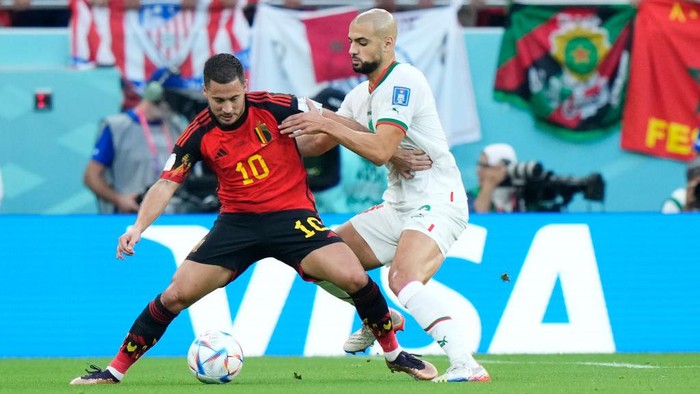 Eden Hazard Left Winger of Belgium and Real Madrid and Sofyan Amrabat defensive midfield of Morocco and ACF Fiorentina compete for the ball during the FIFA World Cup Qatar 2022 Group F match between Belgium and Morocco at Al Thumama Stadium on November 27, 2022 in Doha, Qatar. (Photo by Jose Breton/Pics Action/NurPhoto via Getty Images)