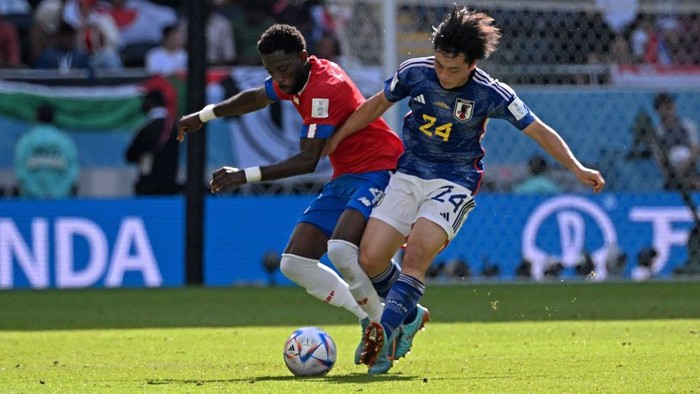 Costa Ricas defender #04 Keysher Fuller (L) fights for the ball with Japans midfielder #24 Yuki Soma during the Qatar 2022 World Cup Group E football match between Japan and Costa Rica at the Ahmad Bin Ali Stadium in Al-Rayyan, west of Doha on November 27, 2022. (Photo by Anne-Christine POUJOULAT / AFP) (Photo by ANNE-CHRISTINE POUJOULAT/AFP via Getty Images)