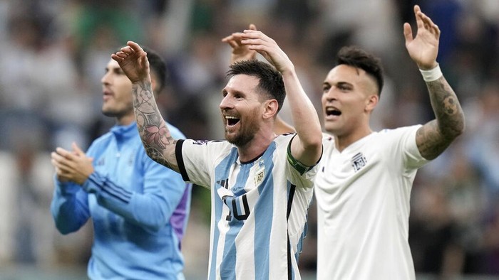 Argentinas Lionel Messi, center, celebrates at the end of the World Cup group C soccer match between Argentina and Mexico, at the Lusail Stadium in Lusail, Qatar, Saturday, Nov. 26, 2022. Argentina won 2-0. (AP Photo/Moises Castillo)