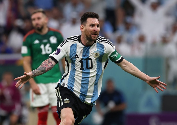 LUSAIL CITY, QATAR - NOVEMBER 26: Enzo Fernandez of Argentina celebrates with teammate Lionel Messi after scoring their teams second goal  during the FIFA World Cup Qatar 2022 Group C match between Argentina and Mexico at Lusail Stadium on November 26, 2022 in Lusail City, Qatar. (Photo by Maja Hitij - FIFA/FIFA via Getty Images)