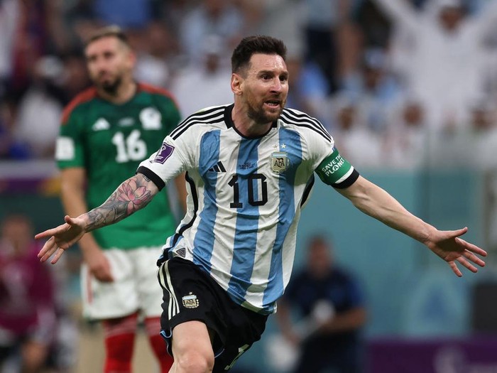 LUSAIL CITY, QATAR - NOVEMBER 26: Enzo Fernandez of Argentina celebrates with teammate Lionel Messi after scoring their team's second goal  during the FIFA World Cup Qatar 2022 Group C match between Argentina and Mexico at Lusail Stadium on November 26, 2022 in Lusail City, Qatar. (Photo by Maja Hitij - FIFA/FIFA via Getty Images)