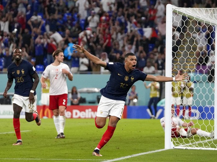 France's Kylian Mbappe celebrates after scoring his sides second goal during the World Cup group D soccer match between France and Denmark, at the Stadium 974 in Doha, Qatar, Saturday, Nov. 26, 2022. (AP Photo/Thanassis Stavrakis)