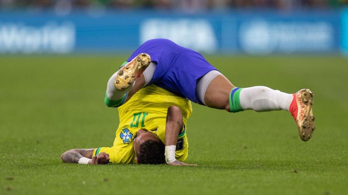 LUSAIL CITY, QATAR - NOVEMBER 24: Neymar of Brazil falls to the ground during the FIFA World Cup Qatar 2022 Group G match between Brazil (2) and Serbia (0) at Lusail Stadium on November 24, 2022 in Lusail City, Qatar. (Photo by Simon Bruty/Anychance/Getty Images)