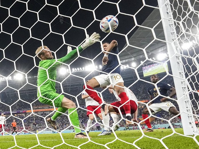 France's Kylian Mbappe scores his side's second goal during the World Cup group D soccer match between France and Denmark, at the Stadium 974 in Doha, Qatar, Saturday, Nov. 26, 2022. (AP Photo/Martin Meissner)