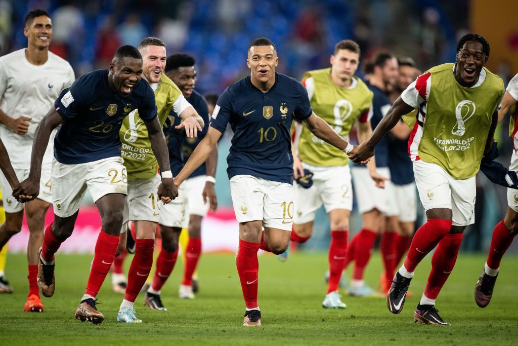 DOHA, QATAR - NOVEMBER 26: Kylian Mbappe (C) and Marcus Thuram (L) of France celebrates victory after the FIFA World Cup Qatar 2022 Group D match between France and Denmark at Stadium 974 on November 26, 2022 in Doha, Qatar. (Photo by Marvin Ibo Guengoer - GES Sportfoto/Getty Images)