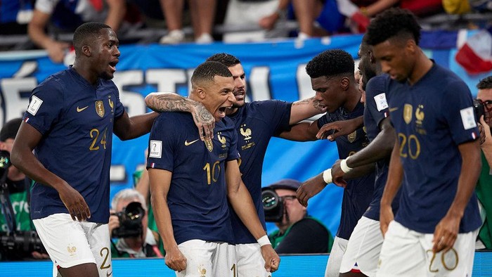 DOHA, QATAR - NOVEMBER 26:  Kylian Mbappe of France celebrates with his team mates after scoring his teams second goal during the FIFA World Cup Qatar 2022 Group D match between France and Denmark at Stadium 974 on November 26, 2022 in Doha, Qatar. (Photo by Juan Luis Diaz/Quality Sport Images/Getty Images)