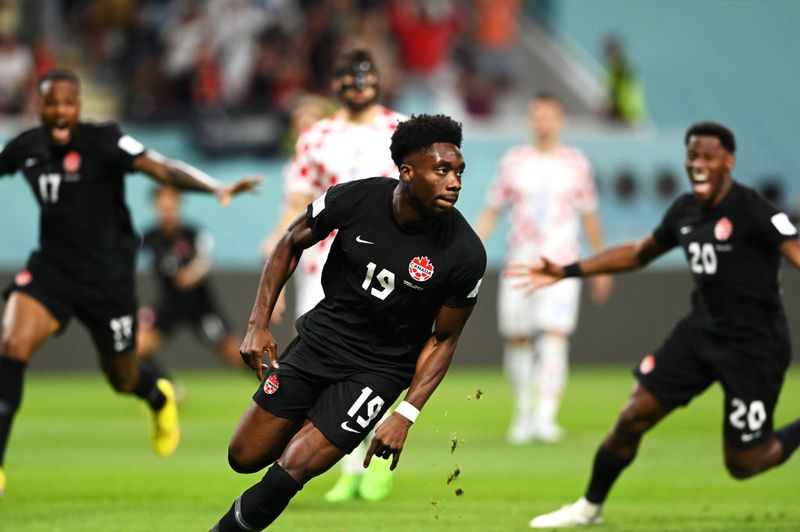 DOHA, QATAR - NOVEMBER 27: Alphonso Davies of Canada celebrates after scoring their team's first goal during the FIFA World Cup Qatar 2022 Group F match between Croatia and Canada at Khalifa International Stadium on November 27, 2022 in Doha, Qatar. (Photo by Claudio Villa/Getty Images)