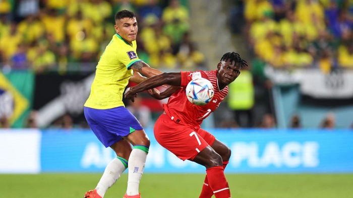 DOHA, QATAR - NOVEMBER 28: Thiago Silva of Brazil and Breel Embolo of Switzerland during the FIFA World Cup Qatar 2022 Group G match between Brazil and Switzerland at Stadium 974 on November 28, 2022 in Doha, Qatar. (Photo by Robbie Jay Barratt - AMA/Getty Images)