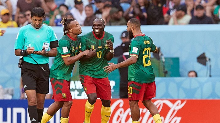 AL WAKRAH, QATAR - NOVEMBER 28:  Vincent Aboubakar of Cameroon celebrates with his team mates after scoring his teams second goal during the FIFA World Cup Qatar 2022 Group G match between Cameroon and Serbia at Al Janoub Stadium on November 28, 2022 in Al Wakrah, Qatar. (Photo by Juan Luis Diaz/Quality Sport Images/Getty Images)