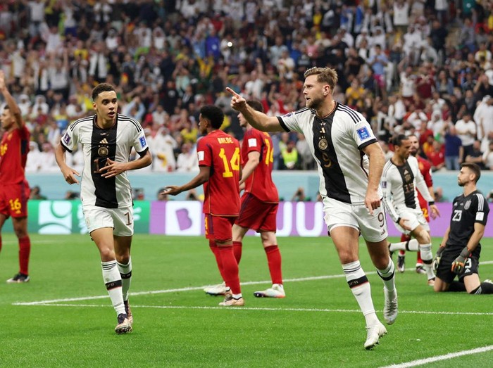 Soccer Football - FIFA World Cup Qatar 2022 - Group E - Spain v Germany - Al Bayt Stadium, Al Khor, Qatar - November 27, 2022 Germany's Niclas Fullkrug celebrates scoring their first goal with Jamal Musiala REUTERS/Matthew Childs     TPX IMAGES OF THE DAY
