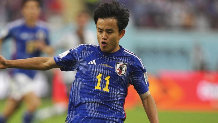 Japans Takefusa Kubo in action during the World Cup group E soccer match between Germany and Japan, at the Khalifa International Stadium in Doha, Qatar, Wednesday, Nov. 23, 2022. (AP Photo/Matthias Schrader)