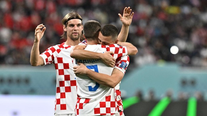 DOHA, QATAR - NOVEMBER 27: Andrej Kramaric #9 of Croatia celebrates with teammates after scoring a goal during the Qatar 2022 World Cup Group F football match between Croatia and Canada at the Khalifa International Stadium in Doha on November 27, 2022. (Photo by Serhat Cagdas/Anadolu Agency via Getty Images)