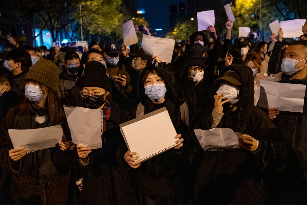 BEIJING, CHINA - NOVEMBER 27: Demonstrators hold white signs as a form of protest during a protest against Zero Covid and epidemic prevention restrictions in Beijing, China, on Sunday, November 27, 2022. (Photo by Stringer/Anadolu Agency via Getty Images)