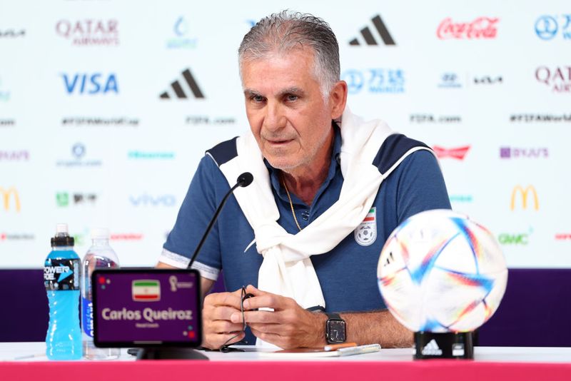 DOHA, QATAR - NOVEMBER 28: Carlos Queiroz, Head Coach of IR Iran, speaks during the IR Iran Press Conference at the Main Media Center on November 28, 2022 in Doha, Qatar. (Photo by Hector Vivas - FIFA/FIFA via Getty Images)