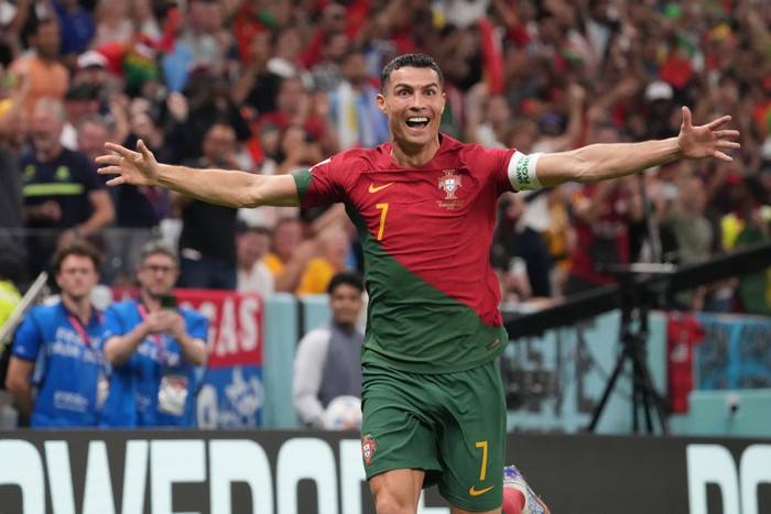 Cristiano Ronaldo LUSAIL CITY, QATAR - NOVEMBER 28: Cristiano Ronaldo of Portugal celebrates his side's first goal during the FIFA World Cup Qatar 2022 Group H match between Portugal and Uruguay at Lusail Stadium on November 28, 2022 in Lusail City, Qatar. (Photo by Etsuo Hara/Getty Images)