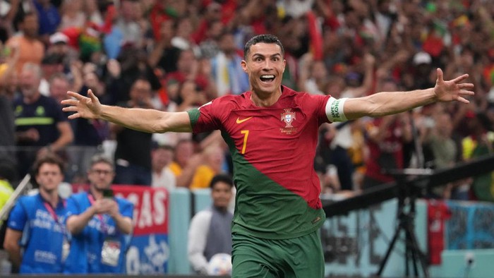 LUSAIL CITY, QATAR - NOVEMBER 28: Cristiano Ronaldo of Portugal celebrates his sides first goal during the FIFA World Cup Qatar 2022 Group H match between Portugal and Uruguay at Lusail Stadium on November 28, 2022 in Lusail City, Qatar. (Photo by Etsuo Hara/Getty Images)