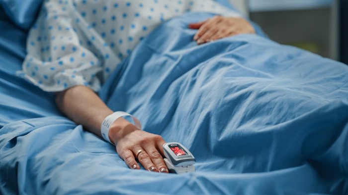 Hospital Ward: Portrait of Beautiful Young Woman Sleeping in Bed, Fully Recovering after Sickness. Female Patient Dreaming About Her Happy Healthy Future.