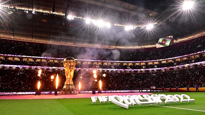 A big replica of the World Cup trophy is seen on the pitch ahead of the Qatar 2022 World Cup Group E football match between Spain and Germany at the Al-Bayt Stadium in Al Khor, north of Doha on November 27, 2022. (Photo by JAVIER SORIANO / AFP) (Photo by JAVIER SORIANO/AFP via Getty Images)