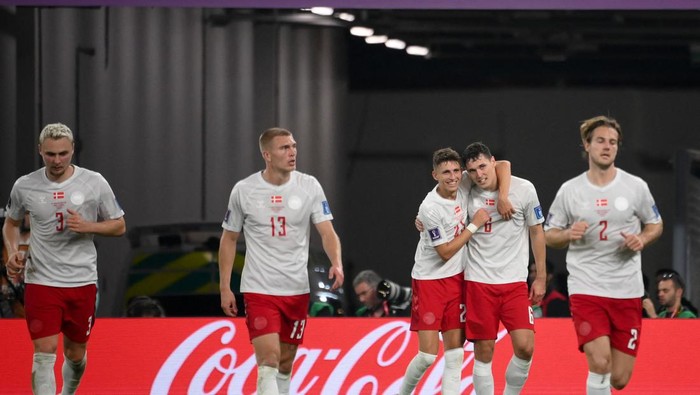 Denmarks defender #06 Andreas Christensen (2nd-R) celebrates with teammates after scoring his teams first goal during the Qatar 2022 World Cup Group D football match between France and Denmark at Stadium 974 in Doha on November 26, 2022. (Photo by FRANCK FIFE / AFP) (Photo by FRANCK FIFE/AFP via Getty Images)
