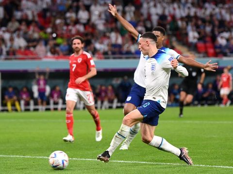 DOHA, QATAR - NOVEMBER 29: Phil Foden of England scores their team's second goal during the FIFA World Cup Qatar 2022 Group B match between Wales and England at Ahmad Bin Ali Stadium on November 29, 2022 in Doha, Qatar. (Photo by Laurence Griffiths/Getty Images)