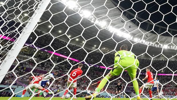 England's Marcus Rashford scores his side's third goal during the World Cup group B soccer match between England and Wales, at the Ahmad Bin Ali Stadium in Al Rayyan , Qatar, Tuesday, Nov. 29, 2022. (AP Photo/Frank Augstein)