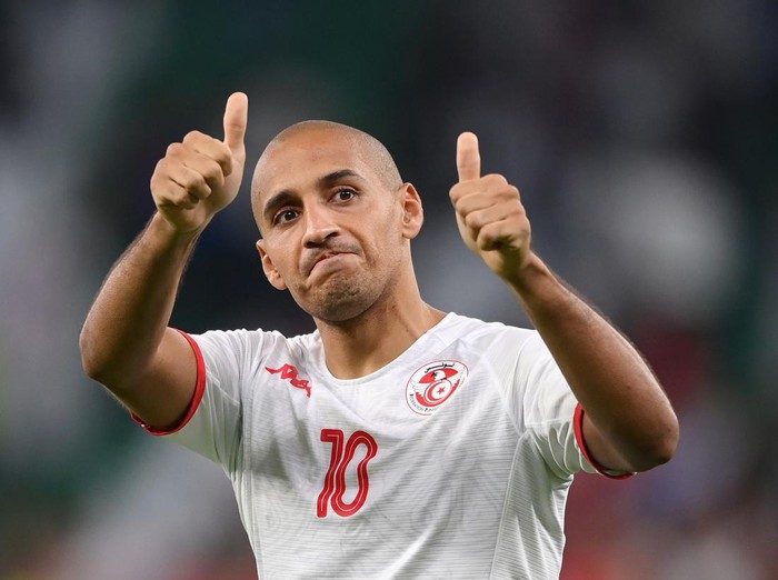 AL RAYYAN, QATAR - NOVEMBER 30: Antoine Griezmann of France helps a dejected Wajdi Kechrida of Tunisia to his feet during the FIFA World Cup Qatar 2022 Group D match between Tunisia and France at Education City Stadium on November 30, 2022 in Al Rayyan, Qatar. (Photo by James Williamson - AMA/Getty Images)
