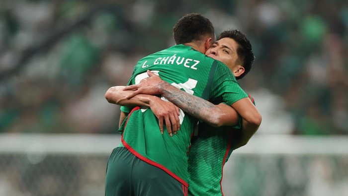 LUSAIL CITY, QATAR - NOVEMBER 30: Luis Chavez of Mexico celebrates with teammates after scoring their teams second goal during the FIFA World Cup Qatar 2022 Group C match between Saudi Arabia and Mexico at Lusail Stadium on November 30, 2022 in Lusail City, Qatar. (Photo by Patrick Smith - FIFA/FIFA via Getty Images)
