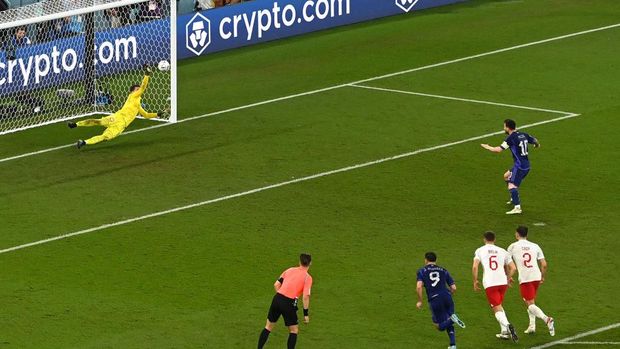 TOPSHOT - Poland's goalkeeper #01 Wojciech Szczesny (L) saves the penalty shot by Argentina's forward #10 Lionel Messi (top R) during the Qatar 2022 World Cup Group C football match between Poland and Argentina at Stadium 974 in Doha on November 30, 2022. (Photo by Glyn KIRK / AFP) (Photo by GLYN KIRK/AFP via Getty Images)