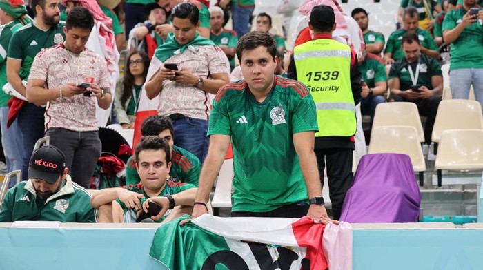 TOPSHOT - A Mexican fan looks after the team was kicked out of the Qatar 2022 World Cup after their 2-1 victory in the Group C football match between Saudi Arabia and Mexico at the Lusail Stadium in Lusail, north of Doha on November 30, 2022. (Photo by KARIM JAAFAR / AFP) (Photo by KARIM JAAFAR/AFP via Getty Images)