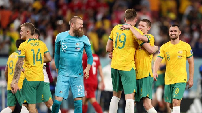 AL WAKRAH, QATAR - NOVEMBER 30: Australia players celebrate their 1-0 victory in during the FIFA World Cup Qatar 2022 Group D match between Australia and Denmark at Al Janoub Stadium on November 30, 2022 in Al Wakrah, Qatar. (Photo by Dean Mouhtaropoulos/Getty Images)