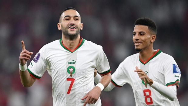 DOHA, QATAR - DECEMBER 01: Hakim Ziyech (L) of Morocco celebrates with Azzedine Ounahi after scoring the team's first goal during the FIFA World Cup Qatar 2022 Group F match between Canada and Morocco at Al Thumama Stadium on December 01, 2022 in Doha, Qatar. (Photo by Matthias Hangst/Getty Images)