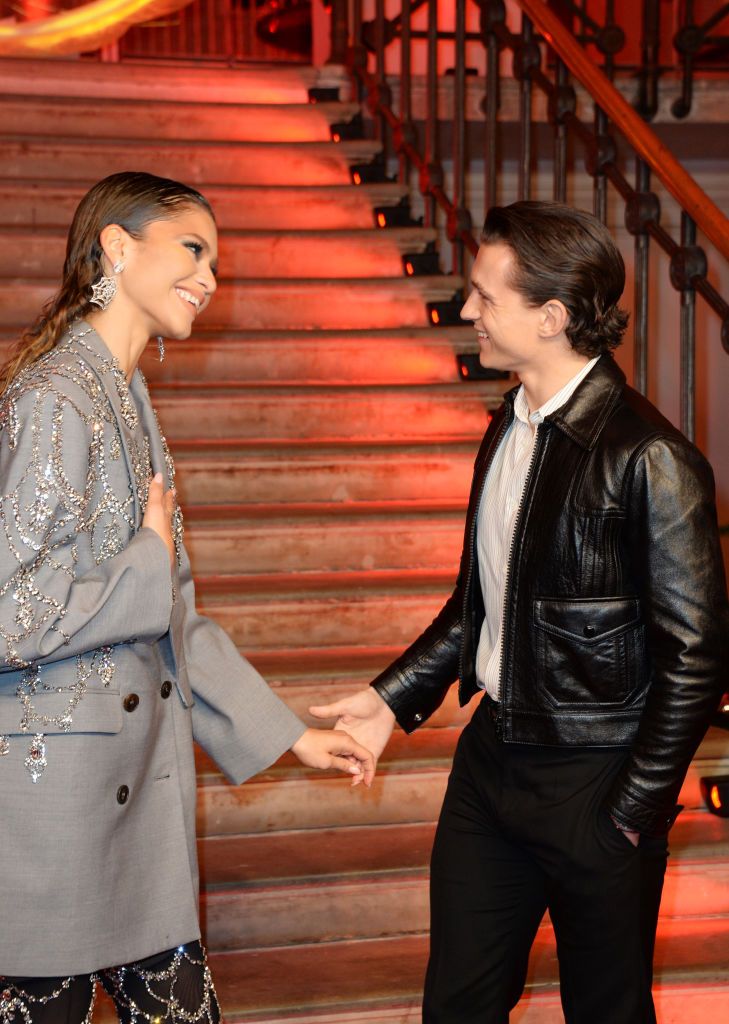 LONDON, ENGLAND - DECEMBER 05:  Zendaya and Tom Holland pose at a photocall for 