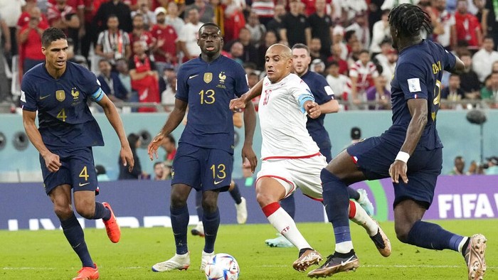 Tunisias Wahbi Khazri dribbles to score his sides opening goal against France during a World Cup group D soccer match at the Education City Stadium in Al Rayyan, Qatar, Wednesday, Nov. 30, 2022. (AP Photo/Martin Meissner)