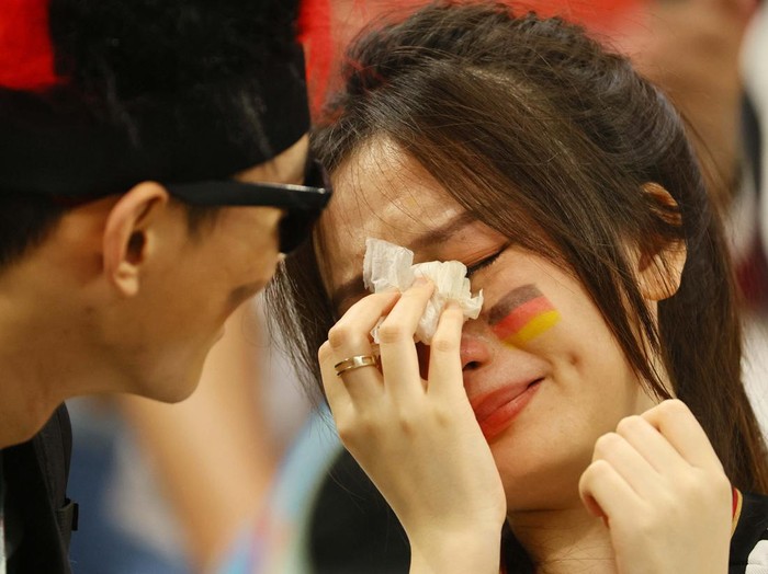 Soccer Football - FIFA World Cup Qatar 2022 - Group E - Costa Rica v Germany - Al Bayt Stadium, Al Khor, Qatar - December 2, 2022
A Germany fan looks dejected after the match as Germany are eliminated from the World Cup REUTERS/Wolfgang Rattay