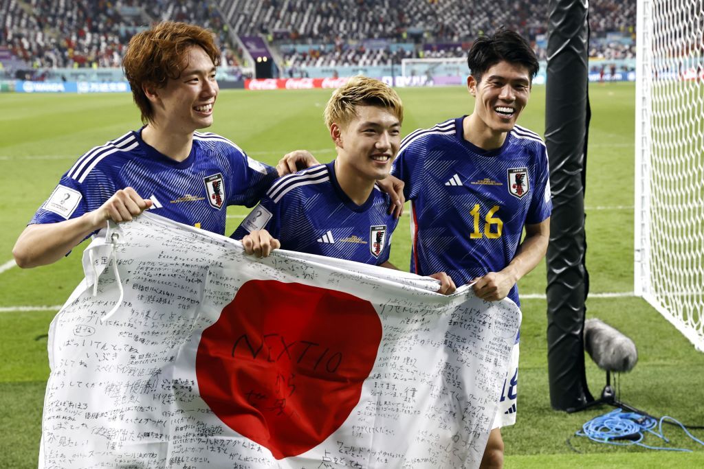 DOHA, QATAR - DECEMBER 01: Ritsu Doan, Hidemasa Morita and Ao Tanaka of Japan celebrate their 2-1 victory and qualification for the knockout stage after during the FIFA World Cup Qatar 2022 Group E match between Japan and Spain at Khalifa International Stadium on December 01, 2022 in Doha, Qatar. (Photo by Clive Mason/Getty Images)