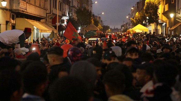 Morocco fans celebrate the victory after the World Cup Group F soccer match between Canada and Morocco, in Casablanca, Thursday, Dec. 1, 2022. Morocco qualified for the round of 16 of the World Cup after hanging on for a 2-1 win over Canada and finished top of the group, (AP Photo/Abdeljalil Bounhar)