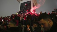 Kemenangan timnas disambut gembira para penggemarnya di kota Rabat. (AP Photo/Kin Cheung)