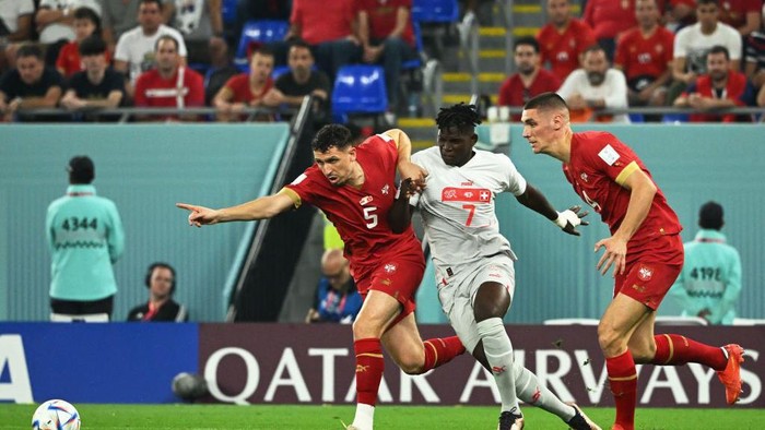 Switzerlands forward #07 Breel Embolo fights for the ball with Serbias defender #05 Milos Veljkovic and Serbias defender #04 Nikola Milenkovic during the Qatar 2022 World Cup Group G football match between Serbia and Switzerland at Stadium 974 in Doha on December 2, 2022. (Photo by Ina Fassbender / AFP) (Photo by INA FASSBENDER/AFP via Getty Images)