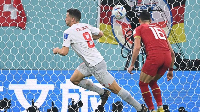 Switzerlands midfielder #08 Remo Freuler celebrates scoring his teams third goal past Switzerlands forward #16 Christian Fassnacht during the Qatar 2022 World Cup Group G football match between Serbia and Switzerland at Stadium 974 in Doha on December 2, 2022. (Photo by Ina Fassbender / AFP) (Photo by INA FASSBENDER/AFP via Getty Images)