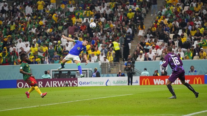 Brazils Gabriel Martinelli makes an attempt to score against Cameroons goalkeeper Devis Epassy during the World Cup group G soccer match between Cameroon and Brazil, at the Lusail Stadium in Lusail, Qatar, Friday, Dec. 2, 2022. (AP Photo/Pavel Golovkin)