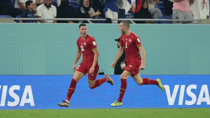 DOHA, QATAR - DECEMBER 02: Dusan Vlahovic of Serbia celebrates with Strahinja Pavlovic after scoring the teams second goal during the FIFA World Cup Qatar 2022 Group G match between Serbia and Switzerland at Stadium 974 on December 02, 2022 in Doha, Qatar. (Photo by Patrick Smith - FIFA/FIFA via Getty Images)
