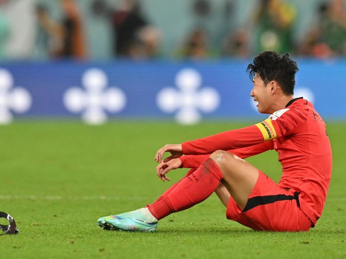 South Korea's midfielder #07 Son Heung-min celebrates his team's victory at the end of the Qatar 2022 World Cup Group H football match between South Korea and Portugal at the Education City Stadium in Al-Rayyan, west of Doha on December 2, 2022. (Photo by Glyn KIRK / AFP) (Photo by GLYN KIRK/AFP via Getty Images)