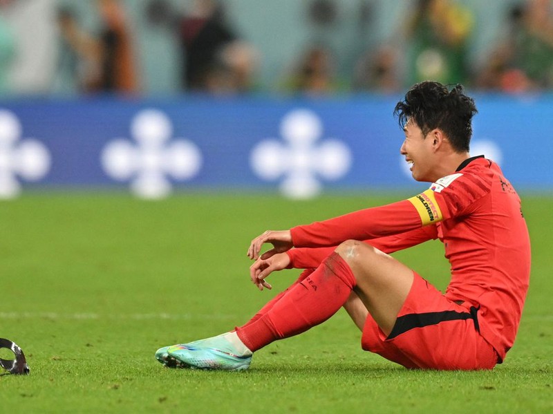South Korea's midfielder #07 Son Heung-min celebrates his team's victory at the end of the Qatar 2022 World Cup Group H football match between South Korea and Portugal at the Education City Stadium in Al-Rayyan, west of Doha on December 2, 2022. (Photo by Glyn KIRK / AFP) (Photo by GLYN KIRK/AFP via Getty Images)