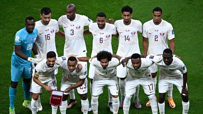 (From Top-L) Qatar's goalkeeper #22 Meshaal Barsham, Qatar's defender #16 Boualem Khoukhi, Qatar's defender #03 Karim Hassan Abdel, Qatar's midfielder #06 Hatim Abdelaziz, Qatar's defender #14 Homam Ahmed, Qatar's defender #02 Pedro Miguel, Qatar's forward #10 Hassan Al-Haydos, Qatar's midfielder #23 Assim Madibo, Qatar's forward #11 Akram Afif, Qatar's defender #17 Ismaiel Mohammed and Qatar's forward #19 Almoez Ali poses for the team picture before the start of the Qatar 2022 World Cup Group A football match between the Netherlands and Qatar at the Al-Bayt Stadium in Al Khor, north of Doha on November 29, 2022. (Photo by Anne-Christine POUJOULAT / AFP) (Photo by ANNE-CHRISTINE POUJOULAT/AFP via Getty Images)