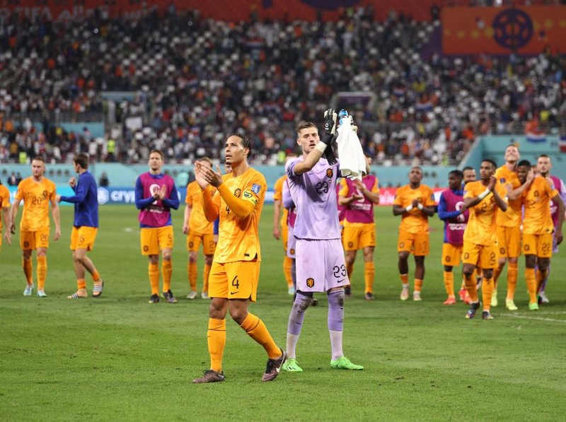 DOHA, QATAR - DECEMBER 03: Andries Noppert and Virgil Van Dijk of Netherlands applaud fans after the 3-1 win in the FIFA World Cup Qatar 2022 Round of 16 match between Netherlands and USA at Khalifa International Stadium on December 03, 2022 in Doha, Qatar. (Photo by Richard Heathcote/Getty Images)