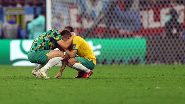 Soccer Football - FIFA World Cup Qatar 2022 - Round of 16 - Argentina v Australia - Ahmad bin Ali Stadium, Al Rayyan, Qatar - December 3, 2022 Australia's Aziz Behich looks dejected after the match as Australia are eliminated from the World Cup REUTERS/Molly Darlington