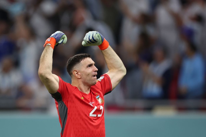 DOHA, QATAR - DECEMBER 03: Emiliano Martinez celebrates after Lionel Messi of Argentina (not pictured) scored their sides first goal during the FIFA World Cup Qatar 2022 Round of 16 match between Argentina and Australia at Ahmad Bin Ali Stadium on December 03, 2022 in Doha, Qatar. (Photo by Alex Grimm/Getty Images)