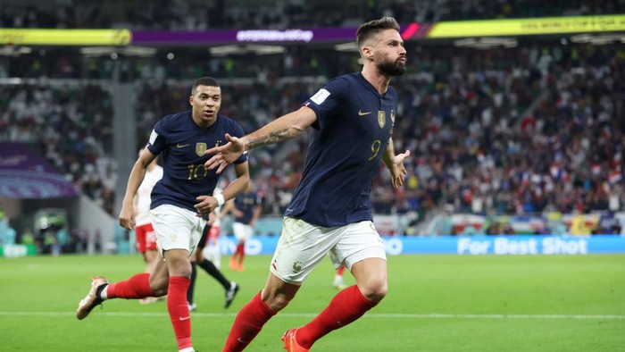DOHA, QATAR - DECEMBER 04: Olivier Giroud of France celebrates after scoring the teams first goal during the FIFA World Cup Qatar 2022 Round of 16 match between France and Poland at Al Thumama Stadium on December 04, 2022 in Doha, Qatar. (Photo by Alex Grimm/Getty Images)