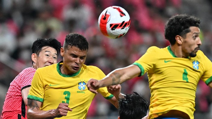 Brazils defender Thiago Silva (2nd L) fights for the ball with South Koreas midfielder Son Heung-min (L) during a friendly football match between South Korea and Brazil at Seoul World Cup Stadium in Seoul on June 2, 2022. (Photo by Jung Yeon-je / AFP) (Photo by JUNG YEON-JE/AFP via Getty Images)